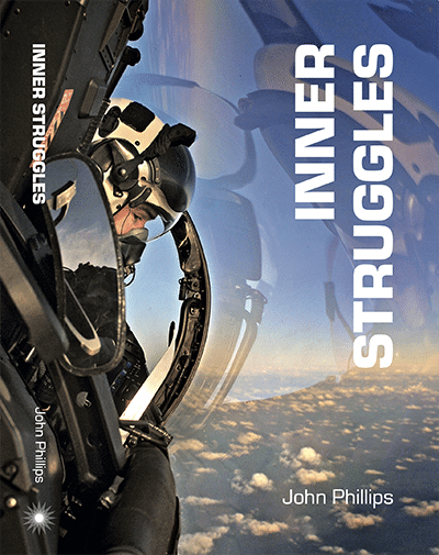 A person wearing a helmet and sunglasses gazes from a helicopter cockpit at the clouds, with the title “Inner Struggles - RAF Edition” by John Phillips boldly shown in white text.